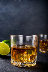 Whiskey with ice in glasses