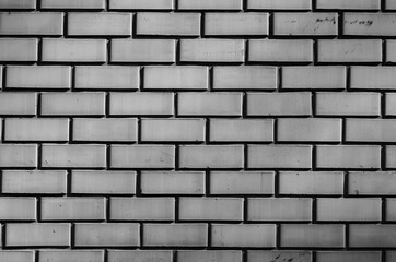 Gray brick wall in natural light.