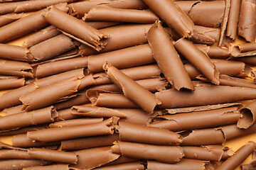 Many chocolate curls as background