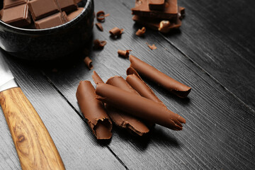 Delicious chocolate curls on table, closeup