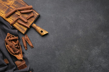 Delicious chocolate curls on dark background