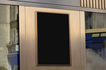 Metal frame hanging in street mockup. Template of a billboard on a wall bathed in sunlight 3D rendering