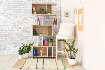 Interior of modern room with shelf unit and chair