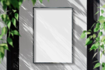 Metal frame hanging in street mockup. Template of a picture framed on a wall bathed in sunlight 3D...