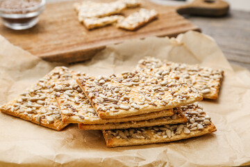 Tasty crackers with seeds, closeup
