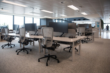 Modern flexible office work space interior fitout rows desks chairs floor cieiling windows T5...