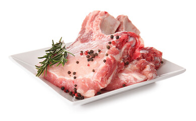 Plate with fresh raw meat and spices on white background