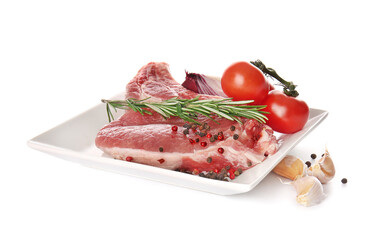 Plate with fresh raw meat and spices on white background