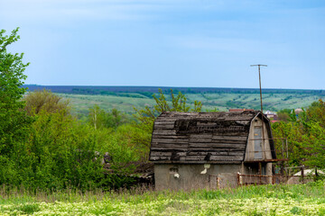 Abandoned and ruined stone and wooden rustic barn