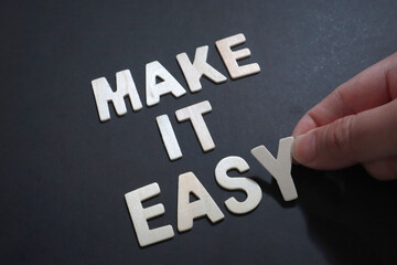 Make it easy, text words typography written on wooden, life and business motivational inspirational