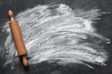 Flour on the table. The process of cooking on the kitchen table, baking.