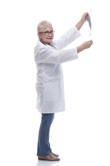 in full growth. female doctor looking at an x- ray of a patient