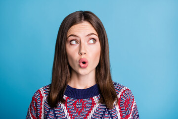 Portrait of attractive amazed girl looking aside copy empty space pout lips isolated over bright blue color background