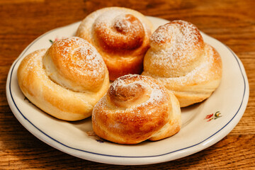 Traditional Easter baking served with honey at breakfast. Delicious homemade hot buns from sweet yeast dough,CZ jidase, traditionally baked in Czech on Holy Maundy Thursday before Easter. Czech food