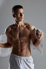 sporty man with muscular torso white workout towel