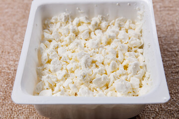 sweet farm cottage cheese on table in eco packaging