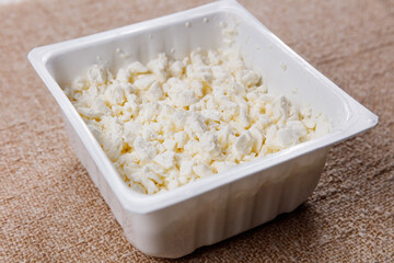 sweet farm cottage cheese on table in eco packaging