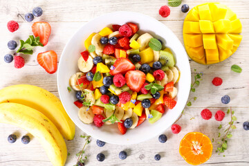 delicious fruit salad with banana, mango and berry fruit