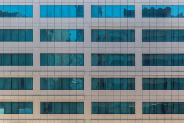 Facade of a building with mirrored windows - 424395848
