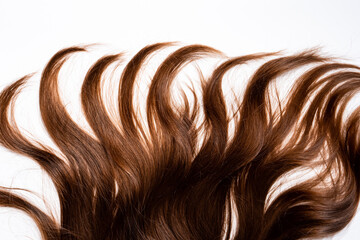 Hair waves curls lie on a white background
