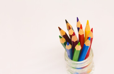 Colored pencils in pencil cap.