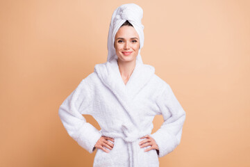 Photo of charming pretty woman hold hands waist spa healthcare good mood isolated on pastel beige...