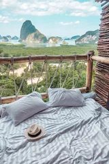 Foto op Plexiglas hat against Phang Nga bay background, Tourists relaxing in tropical resort at Samet Nang She, near Phuket in Southern Thailand. Southeast Asia travel and summer vacation, freelance concept © Jo Panuwat D