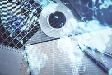 Business theme hologram drawings over computer on the desktop background. Top view. Multi exposure. Concept of international connections.