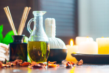 Spa background. Towel, candles, flowers, aroma sticks, massaging stones and herbal balls. Massage, oriental therapy, wellbeing and meditation.