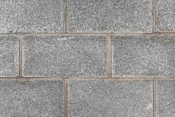 gray new wall of cinder blocks and concrete