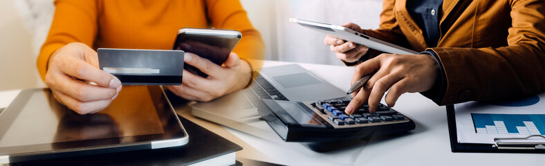 Digital marketing media in virtual screen.businesswoman hand working with mobile phone and modern compute with VR icon diagram at office in morning light