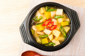 Soup stew seasoned with miso containing vegetables and tofu