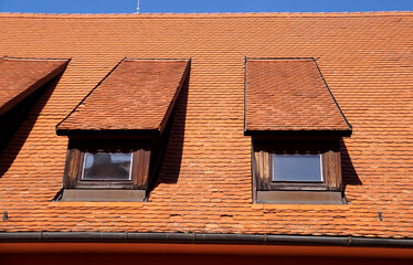 Dormer windows on the roof of the old building