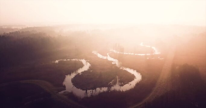 drone video fottage of sunrise over river fogs