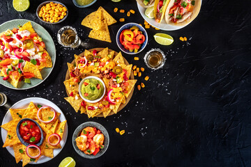 Mexican food overhead flat lay shot on a black slate background