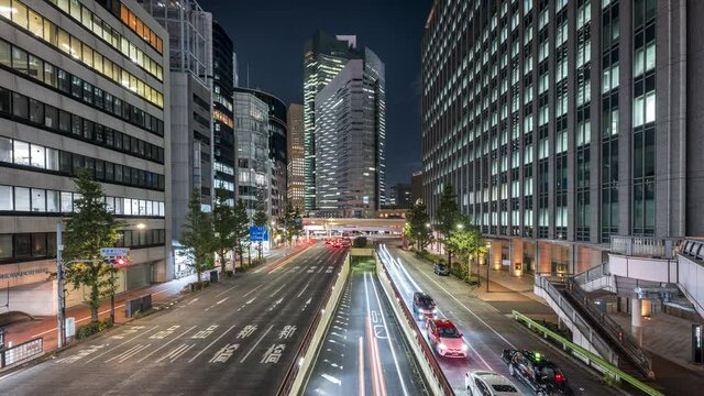 Skyscrapers And Traffic At Night In The Center Of Shopping District Of Ginza In Minato City, Tokyo, Japan. - timelapse