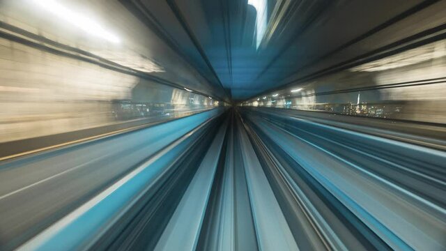 High-rise Buildings In Tokyo City Illuminated At Night Seen From Yurikamome Line In Japan. - POV, hyperlapse