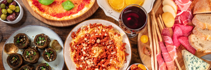 Italian cuisine panorama with antipasti, wine, pasta, and artichokes