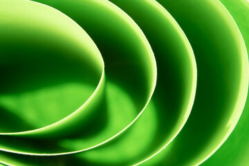 Abstract green colored background with curved lines and shapes