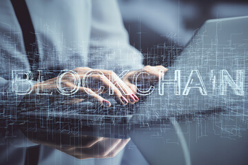 Double exposure of woman hands typing on computer and crypto market theme hologram drawing. Blockchain concept.