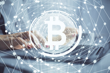 Double exposure of woman hands typing on computer and crypto market theme hologram drawing. Blockchain concept.