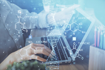 Double exposure of woman hands typing on computer and DNA hologram drawing. Medical education concept.