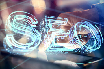 Multi exposure of man's hands holding and using a digital device and seo drawing. search...