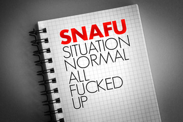 SNAFU - Situation Normal: All Fucked Up acronym on notepad, concept background