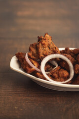 Delicious spicy Chicken Kabab Indian food on wooden table	
