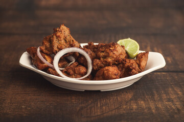 Delicious spicy Chicken Kabab Indian food on wooden table	
