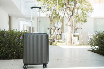 Black Luggage bag or Suitcase in modern hotel or room. Time to travel, journey, trip, summer holiday and vacation concepts