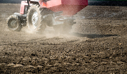 Tractor spreading artificial fertilizers
