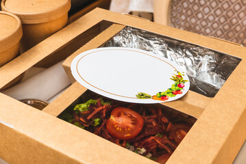 Food in degradable packaging for delivery