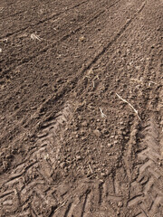 Arable land. Preparing field for planting. Plowed soil in spring time . Agricultural work.
